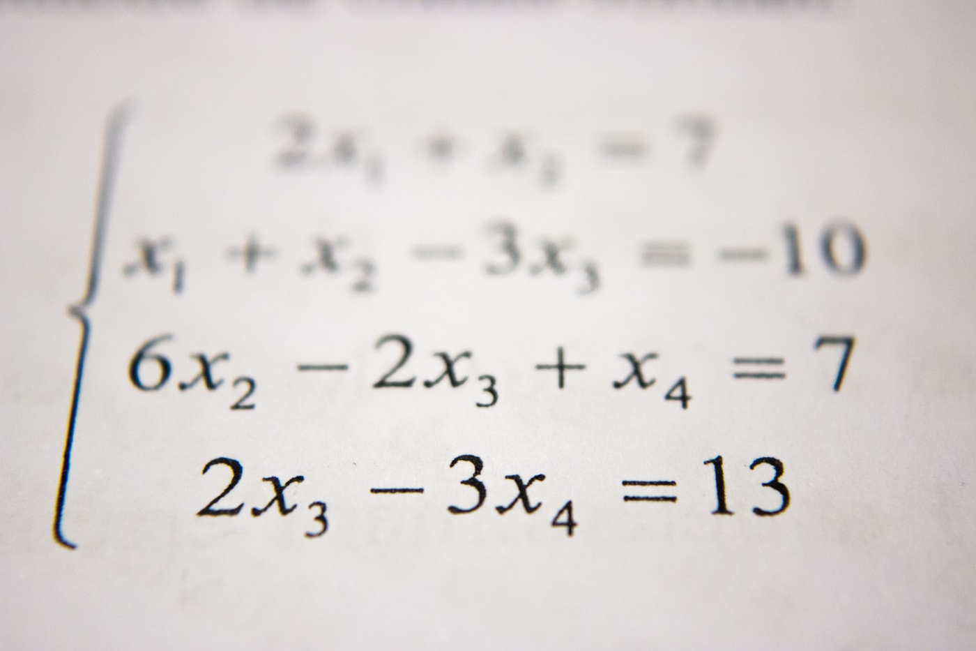 Student working through math at the whiteboard